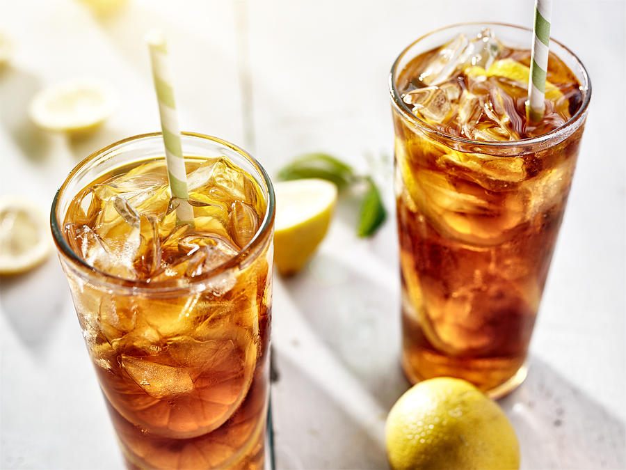 Two Ice Cold Glasses Of Iced Tea With Lemons Photograph by Rez-art