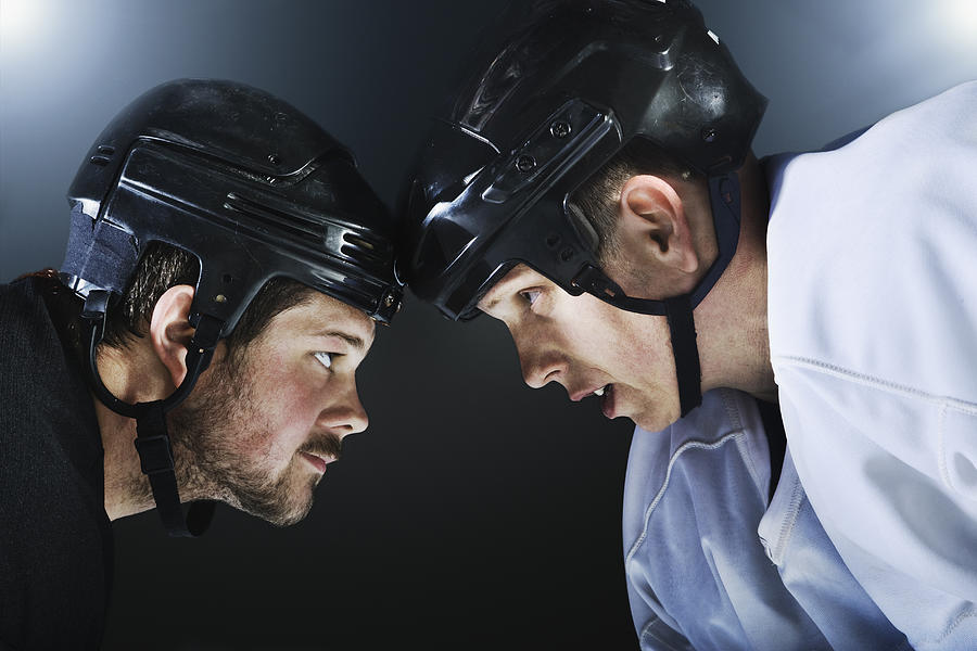 Two ice hockey players facing off. Photograph by Robert Decelis