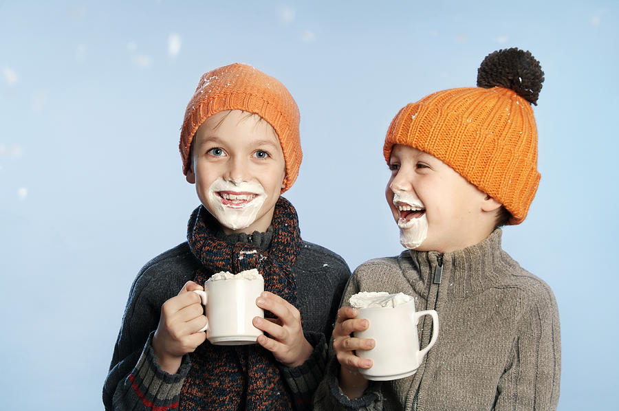 Two kids having fun in the snow drinking hot chocolate Photograph by Maartje van Caspel
