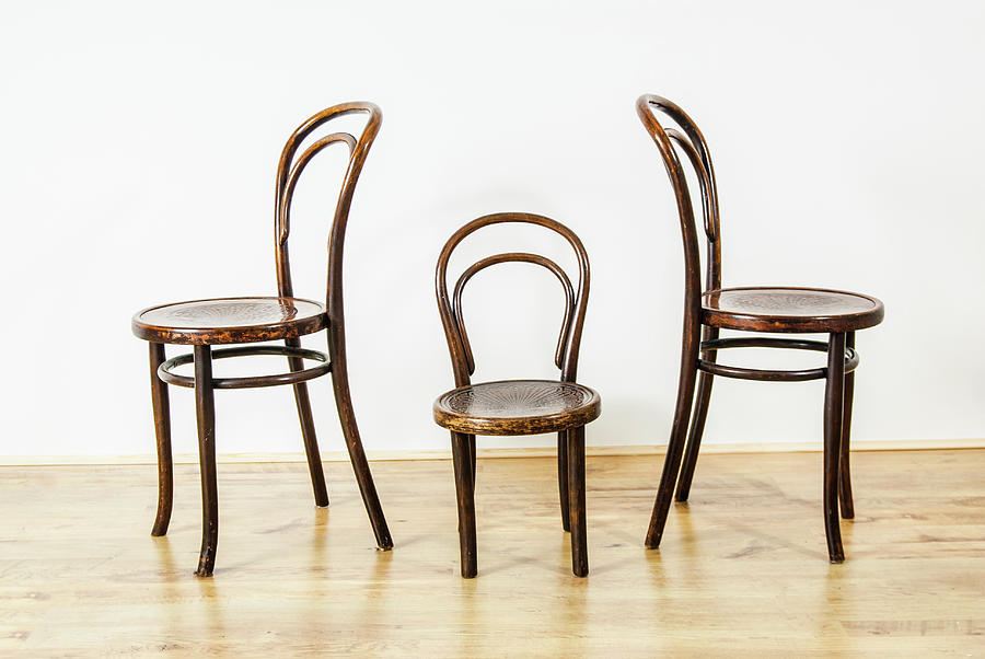 Two Large And One Childs Chair In An Empty Room Photograph
