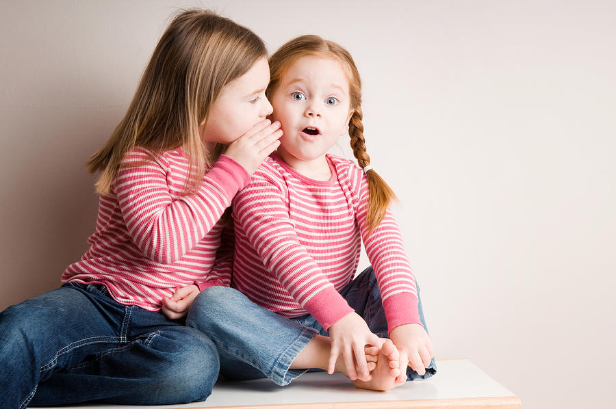 Two Little Girls Whispering Surprising Secrets Photograph by Ideabug