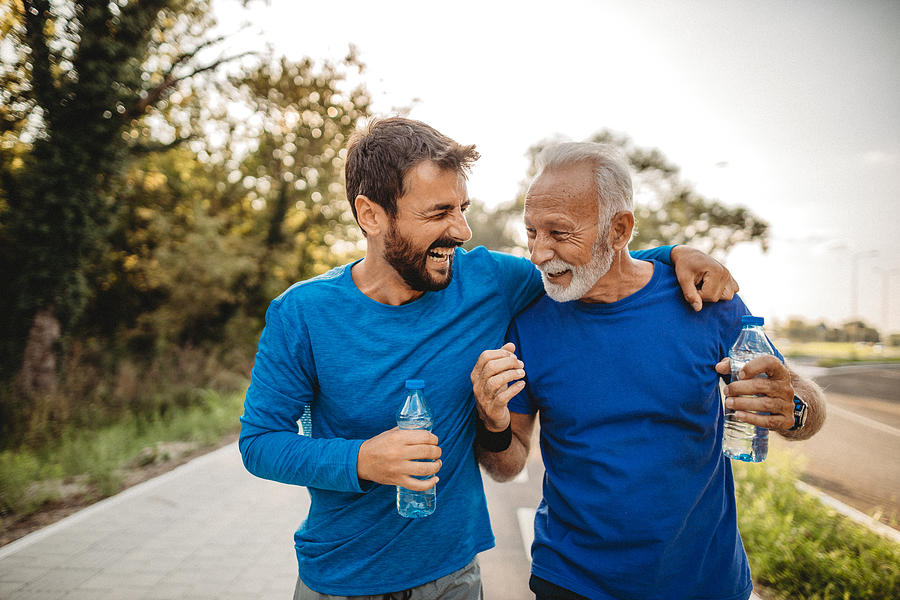 Two men exercising Photograph by Milan2099