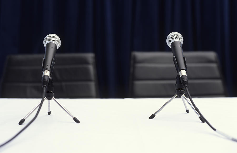 Two microphones on table, close up Photograph by George Doyle