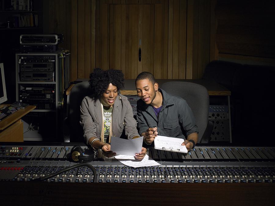 Two music producers working Photograph by Image Source