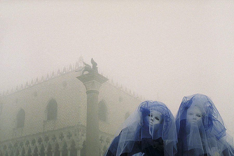 Two mysterious carnival masks with blue veil in foggy Venice Photograph by RelaxFoto.de