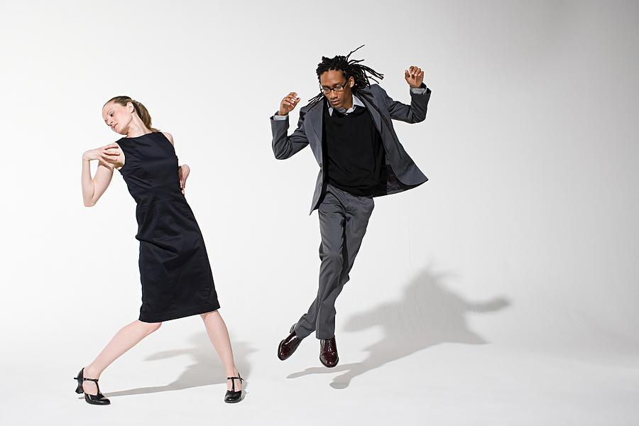 Two office workers dancing Photograph by Image Source