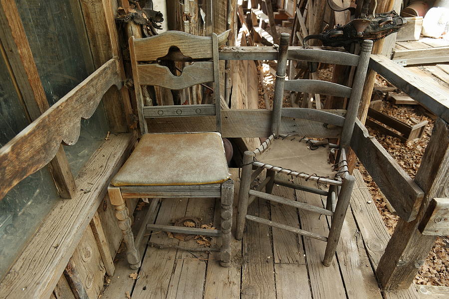Two old wooden chairs Photograph by Jeff Swan