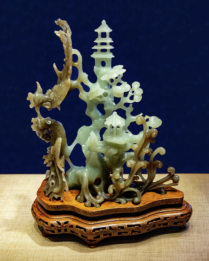 Two phoenixes in celadon and brown jade Photograph by Flees Photos