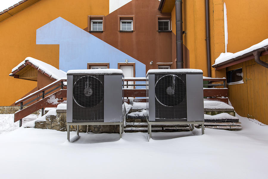Two residential modern heat pumps Photograph by Sebalos