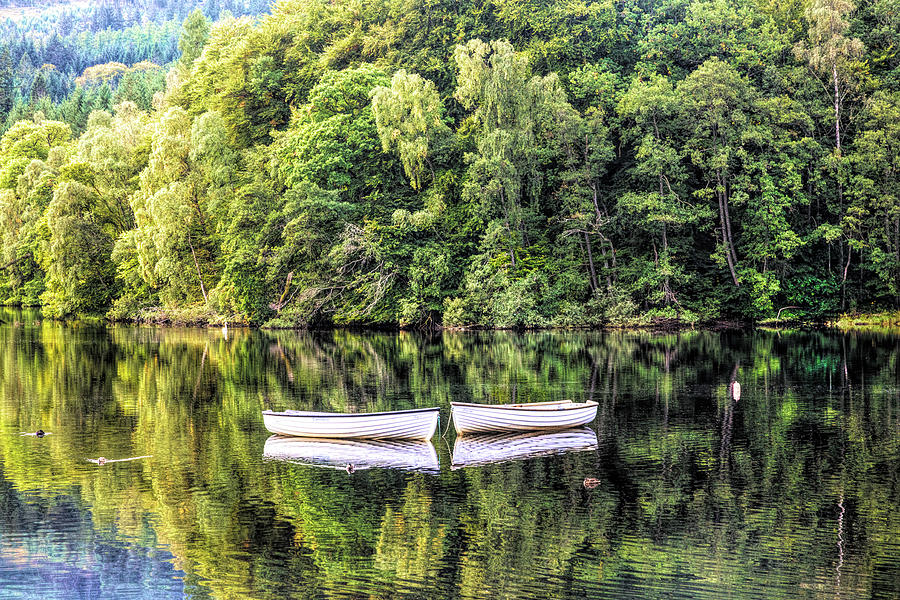 Two Rowboats in the Lake Photograph by Debra and Dave Vanderlaan