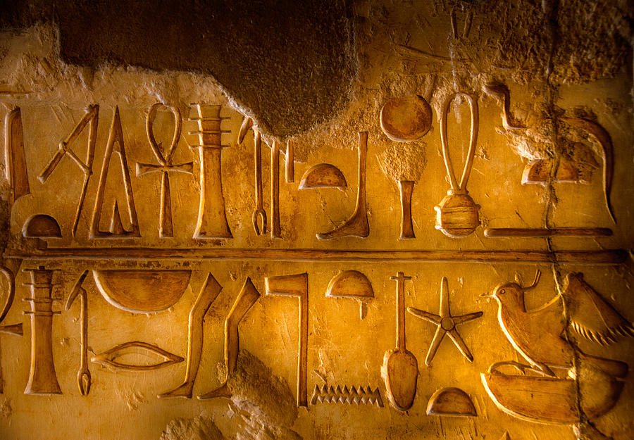 Two rows of Egyptian Hieroglyphics Photograph by Ajiravan