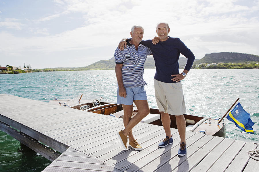 Two senior men standing on jetty Photograph by Felix Wirth