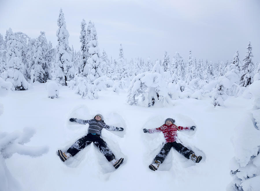Two Snow Angels In A Snowy Forest Photograph by Per Breiehagen