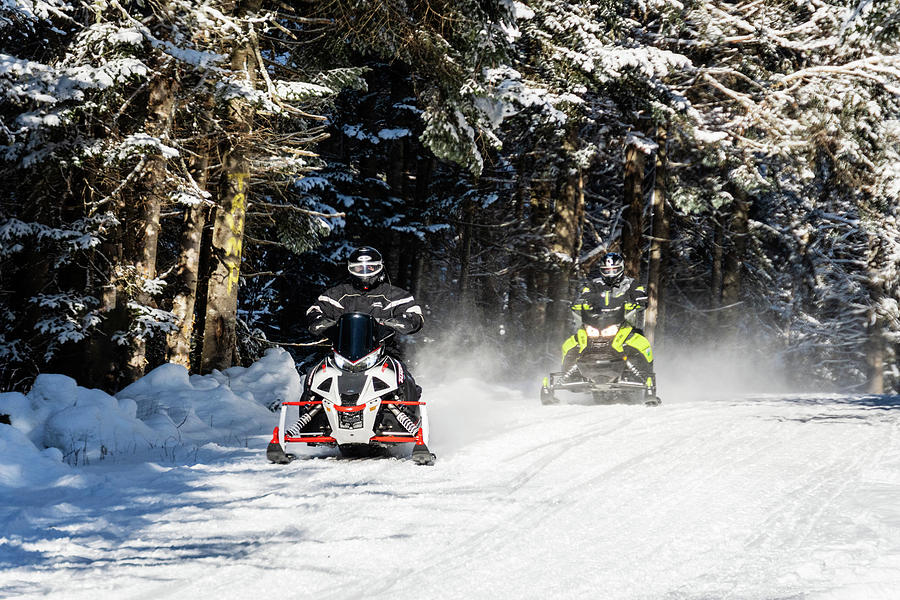 Two Snowmobiles Coming Down The Trail In Pittsburg, New Hampshire Photograph by John Rowe