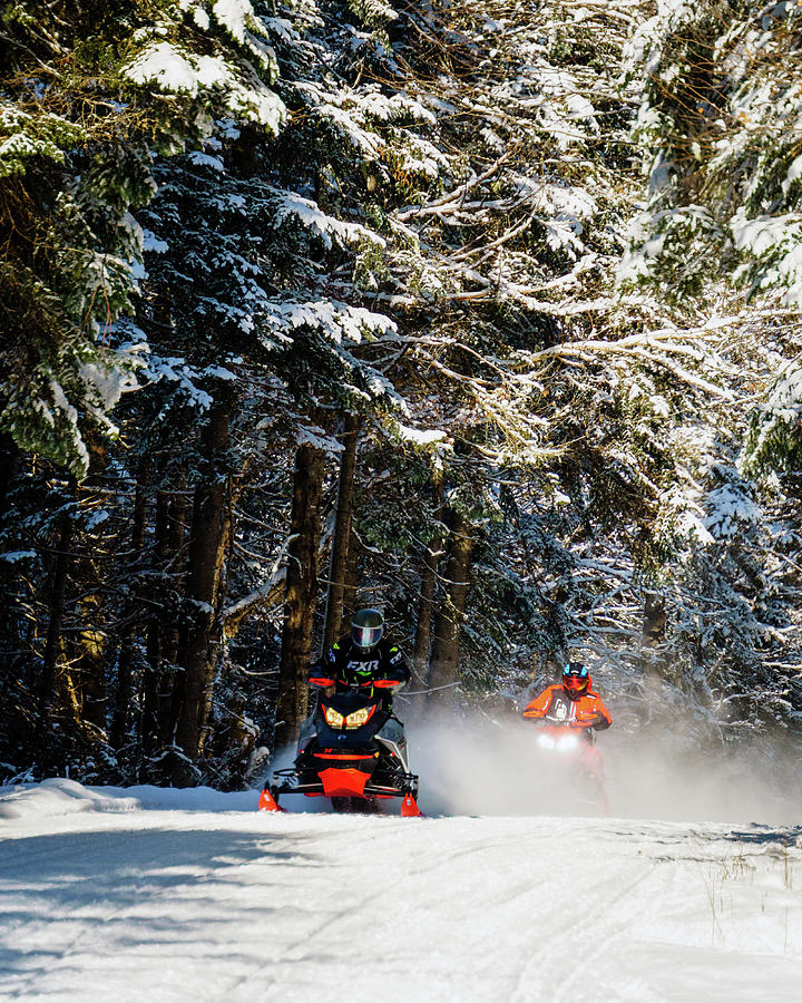 Two Snowmobiles Coming Down The Trail In Pittsburg, New Hampshire Vertical Photograph by John Rowe