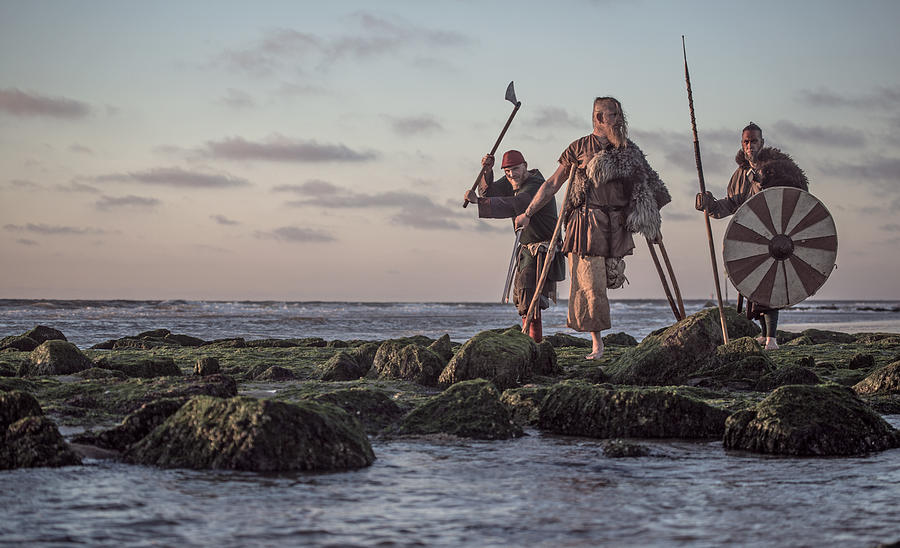 Two sword wielding bloody medieval warriors together on a cold seashore Photograph by Lorado