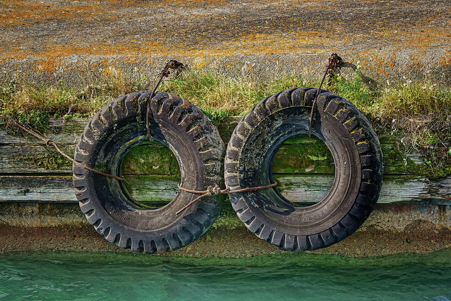 Two Tires on a Pier Photograph by Nikolyn McDonald