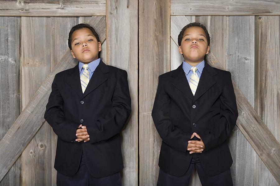 Two twin boys wearing suits Photograph by Image Source