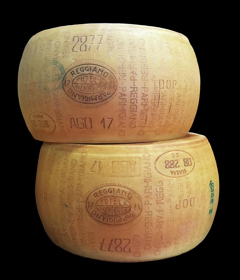 Two Wheels of Parmigiano-Reggiano Cheese On Black Photograph by Deborah League