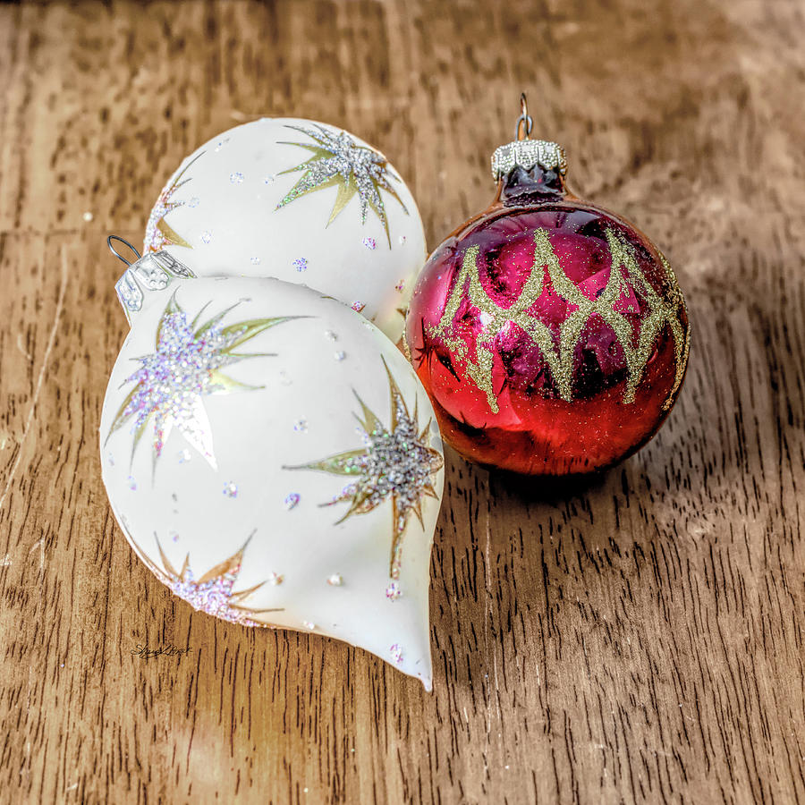 Two white Baubles and a Red One Photograph by Sharon Popek