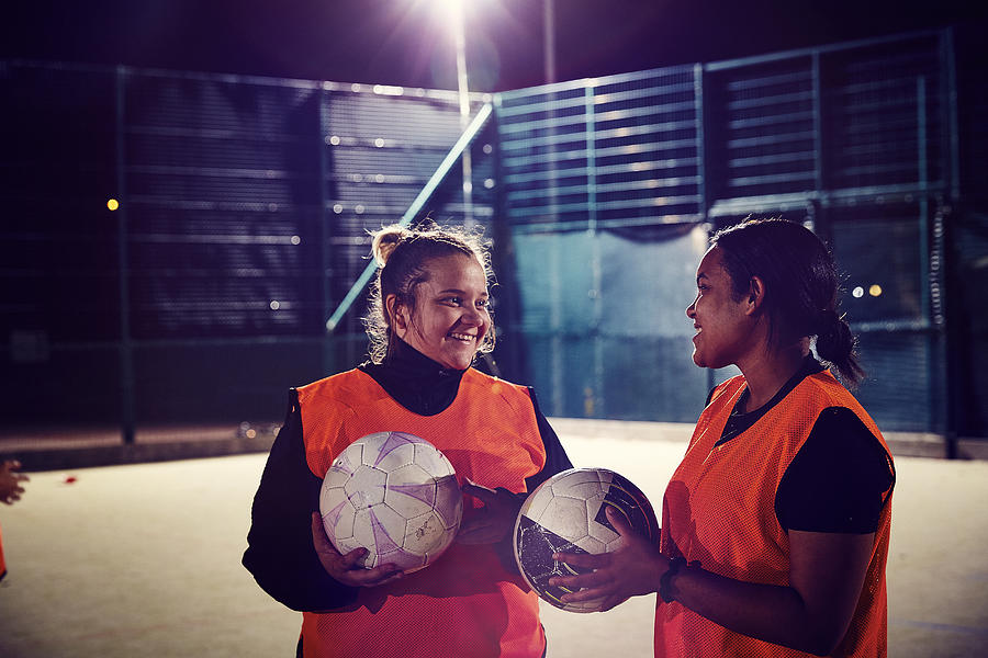 Two women from ladies football team smiling Photograph by Kelvin Murray