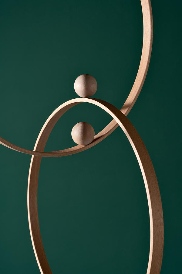 Two Wooden Spheres Moves on Intersected Rings Photograph by MirageC