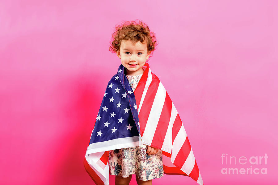 Two year old girl posing sympathetic with the American flag on h Photograph by Joaquin Corbalan