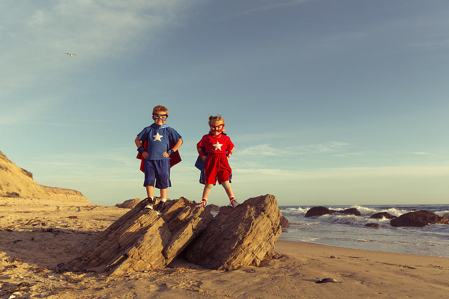 Two Young Children Dressed as Superheroes Stand on Rock Photograph by RichVintage