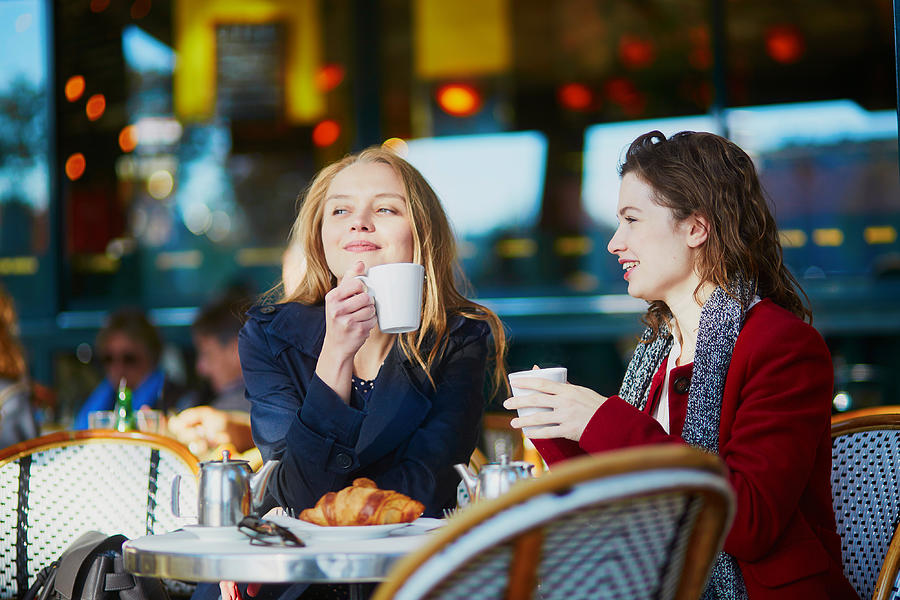 Two young girls in Parisian outdoor cafe Photograph by Encrier