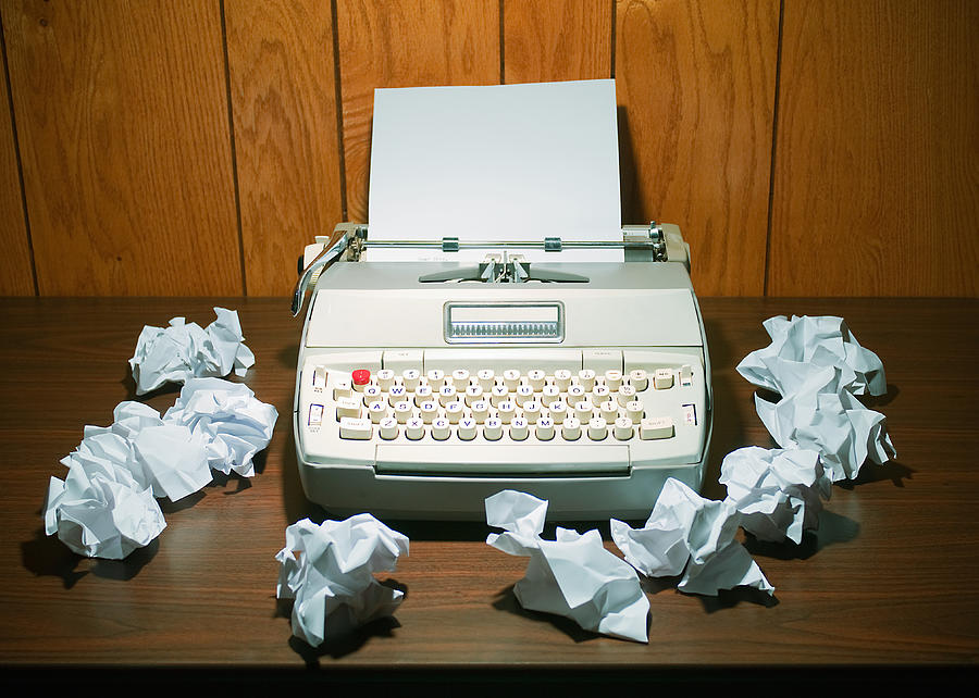 Typewriter and crumpled paper  Photograph by PM Images