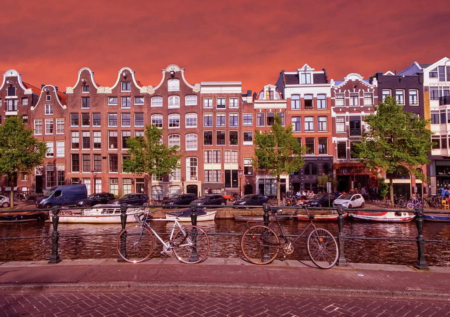 Typical buildings, canal and bikes in Amsterdam, Netherlands Photograph by Elenarts - Elena Duvernay photo