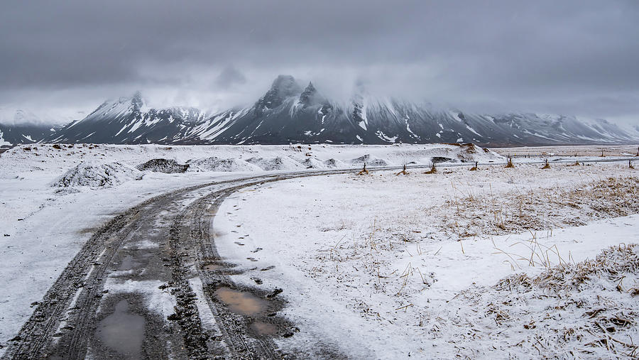 Typical Icelandic snowy nature mountain landscape and empty road Photograph by Michalakis Ppalis