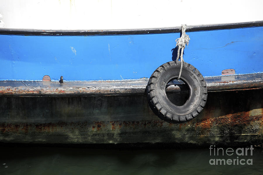 Tyre used as a marine fender Photograph by Bryan Attewell
