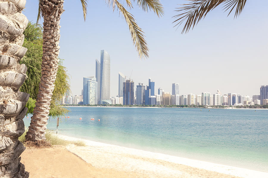 UAE, Abu Dhabi, palm, beach and skyline Photograph by Westend61
