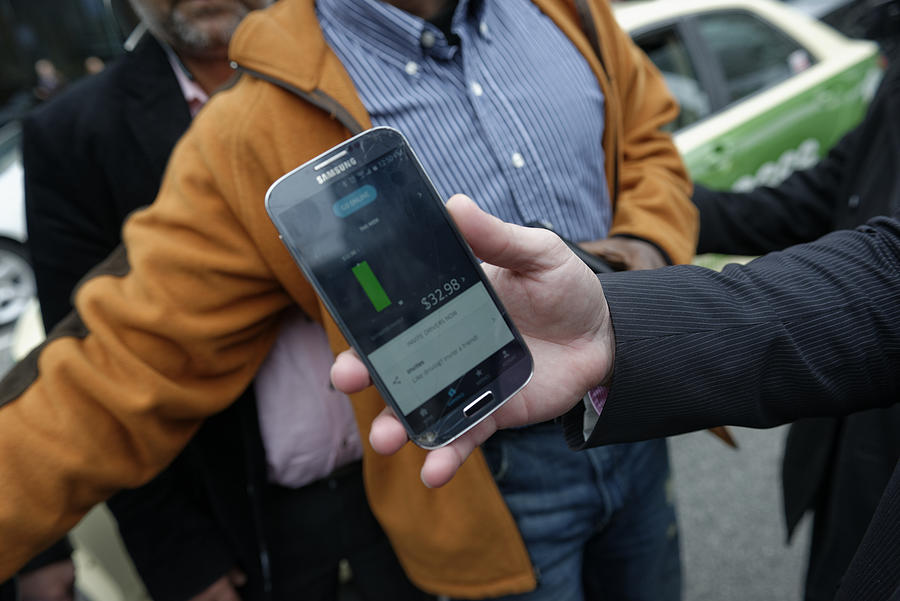 Uber App displays drivers revenue Photograph by Bastiaan Slabbers