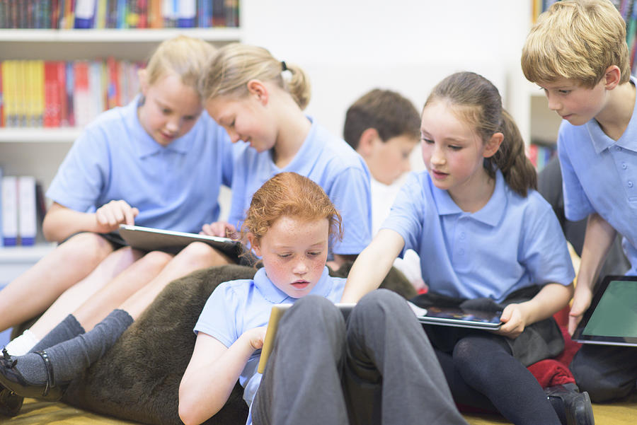 UK School children using technolgy Photograph by OwenPrice