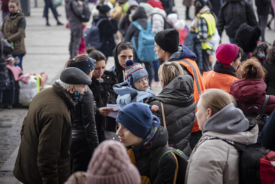 Ukrainians outside the train station in Lviv, Ukraine Photograph by Joel Carillet