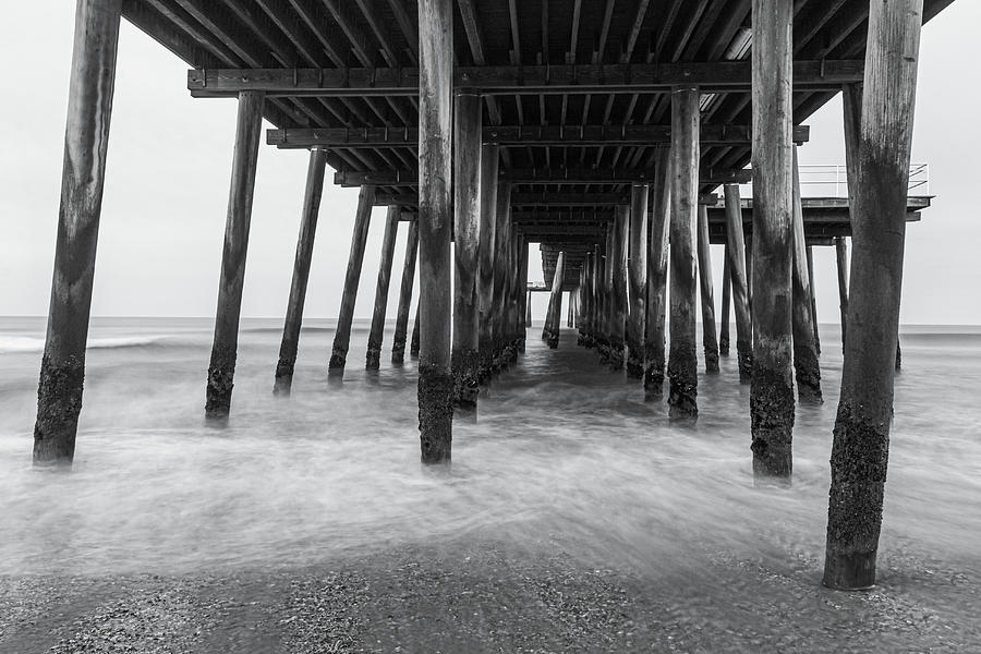 Under The Ventnor Fishing Pier BW Photograph by Kristia Adams