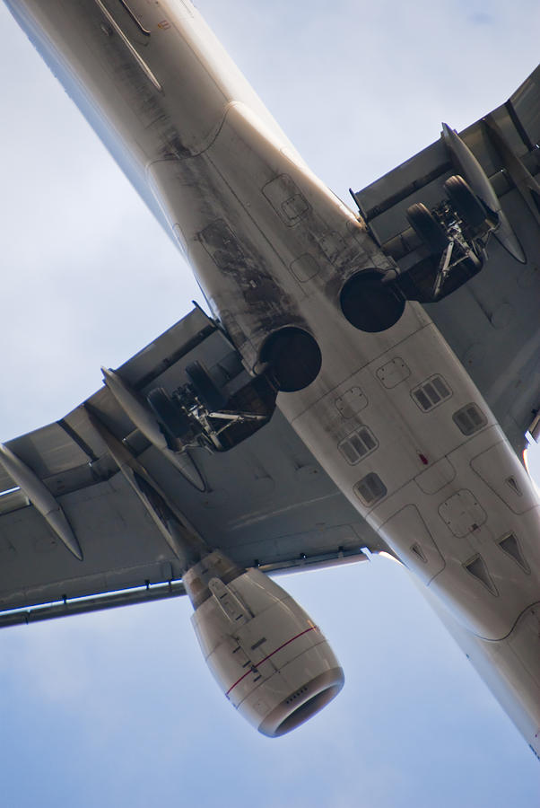 Underside of Commercial Jet Passing Low Overhead, London, England Photograph by Silentfoto