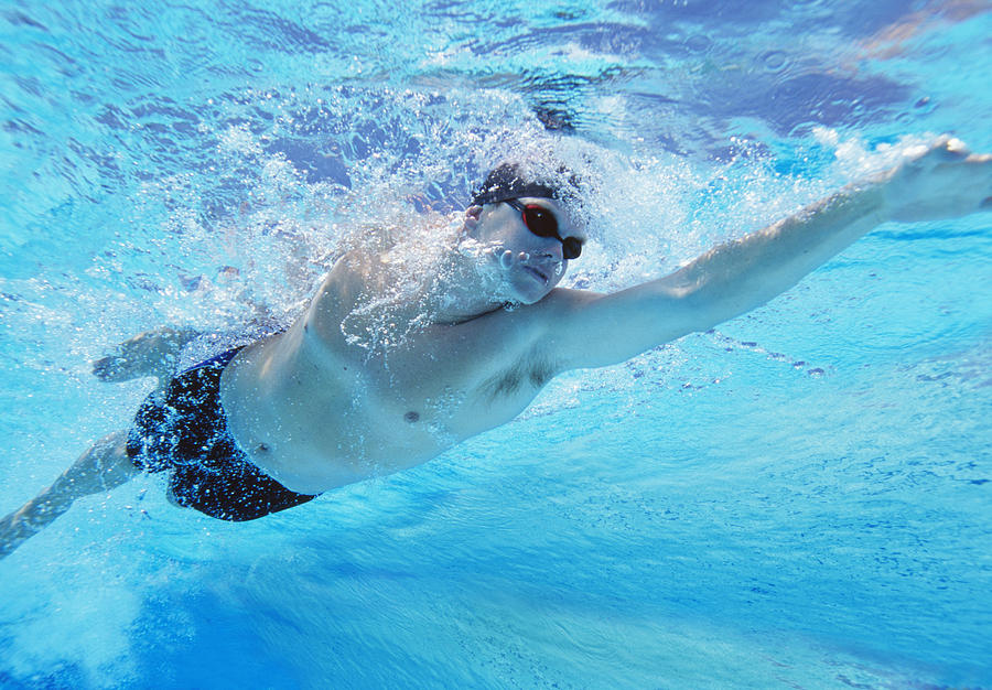 Underwater shot of professional male athlete swimming in pool Photograph by Moodboard