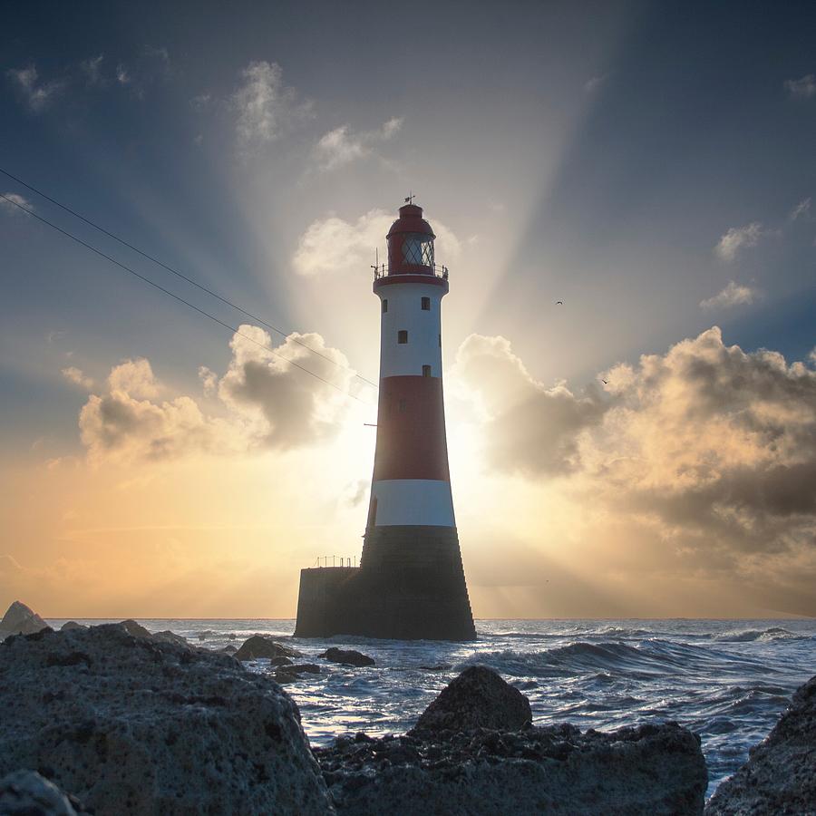 United Kingdom, England, East Sussex, Beachy Head, Beachy Head Lighthouse backlit by rising sun Photograph by Traceyburfield