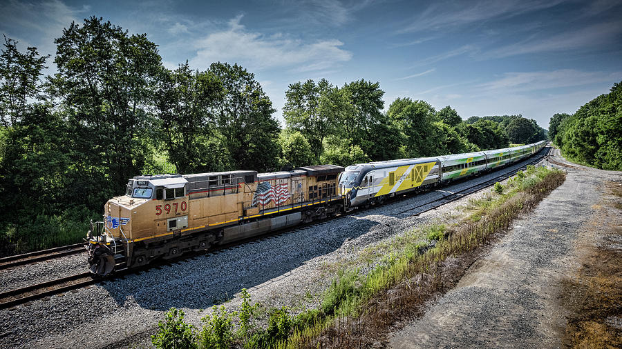 UP 5970 leads CSX S988 as it heads south at Anaconda with Brightline Trains at Robards Kentucky