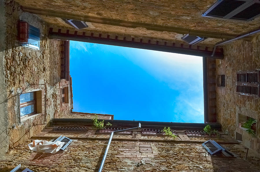 Upward view of a patio with blue sky Photograph by Sir Francis Canker Photography