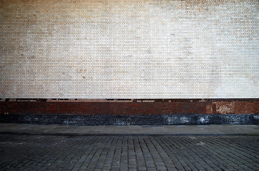 Urban background UK - White brick wall with sidewalk Photograph by Ilbusca