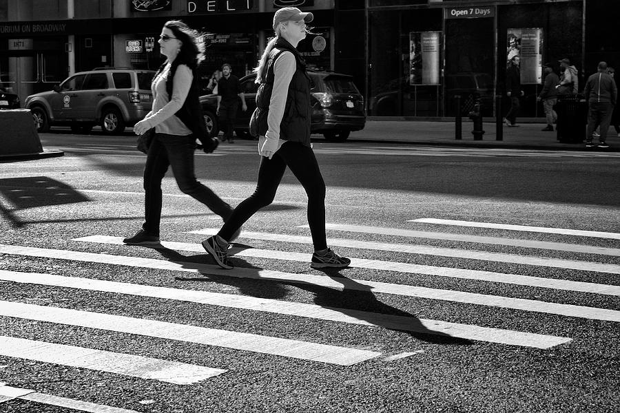 Urban Life, New York City Pedestrians. Two Women Passing in opposite directions in crosswalk, Upper West Side, Manhattan Photograph by JayLazarin