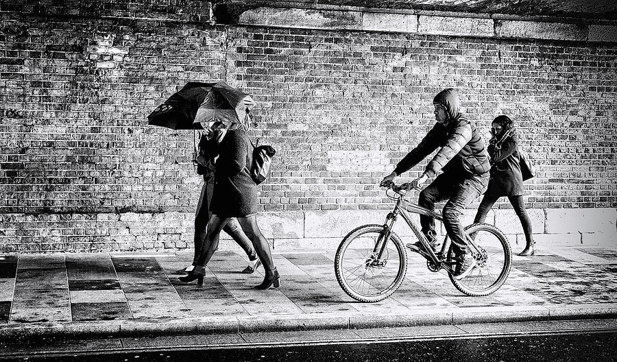Urban Rain and People Under the Bridge Photograph by John Williams