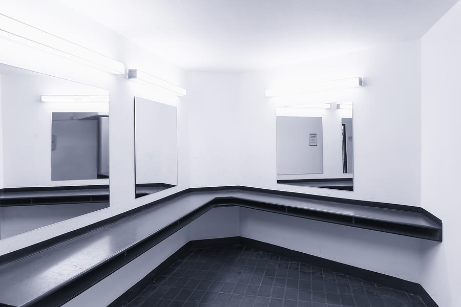 Urinals in public mens washroom Photograph by Ingo Jezierski