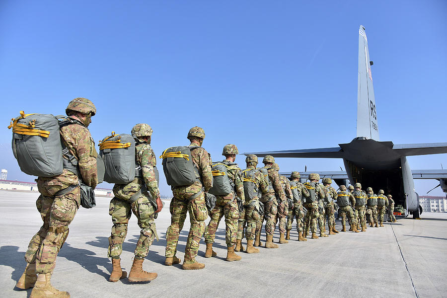 U.S. Army paratroopers jump out of a U.S. Air Force C-130 Hercules