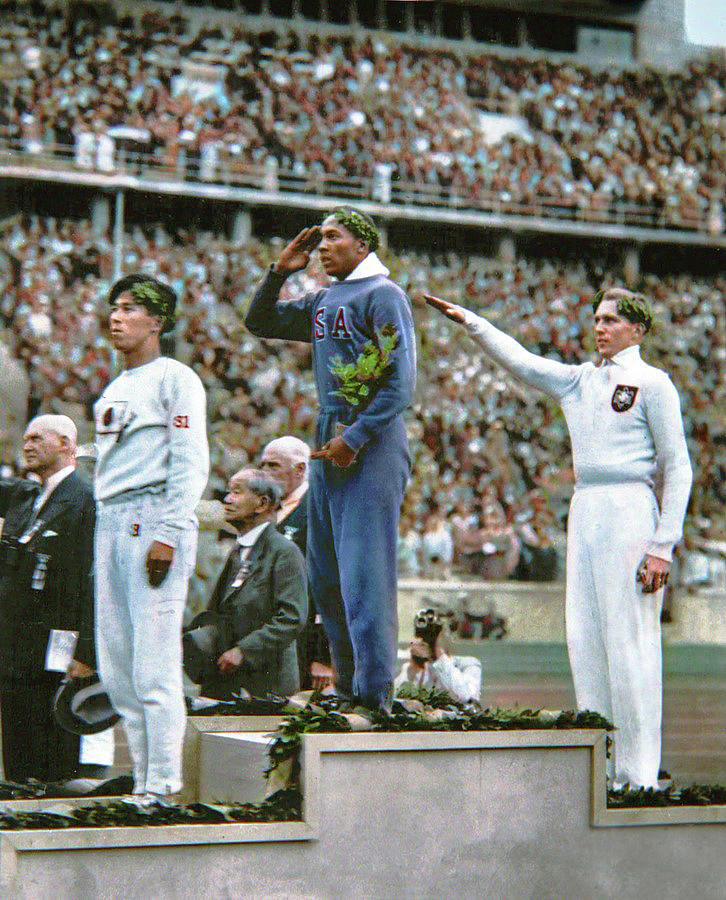U.S. athlete Jesse Owens salutes during the presentation of his gold medal for the long jump, after  Digital Art by Celestial Images