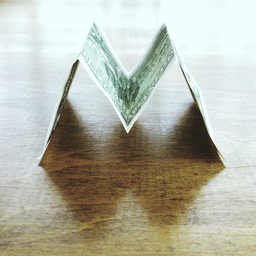 US dollar bill in the shape of the letter M Photograph by Denistorm